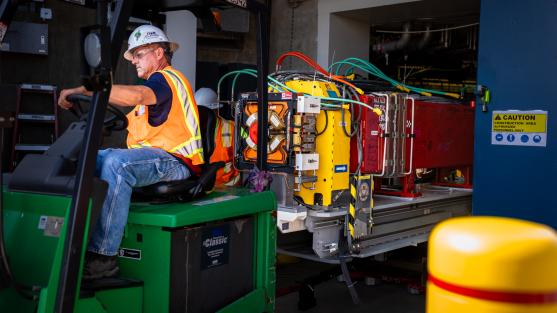 The final girder of magnets is removed from the APS storage ring facility. Image by J.J. Starr, Argonne National Laboratory.